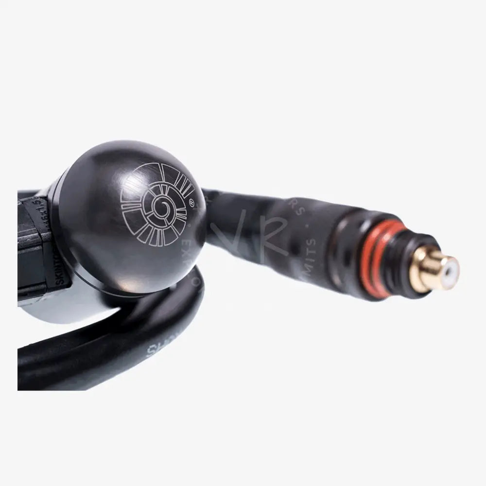 Close-up of a black and red spray gun nozzle on a white background