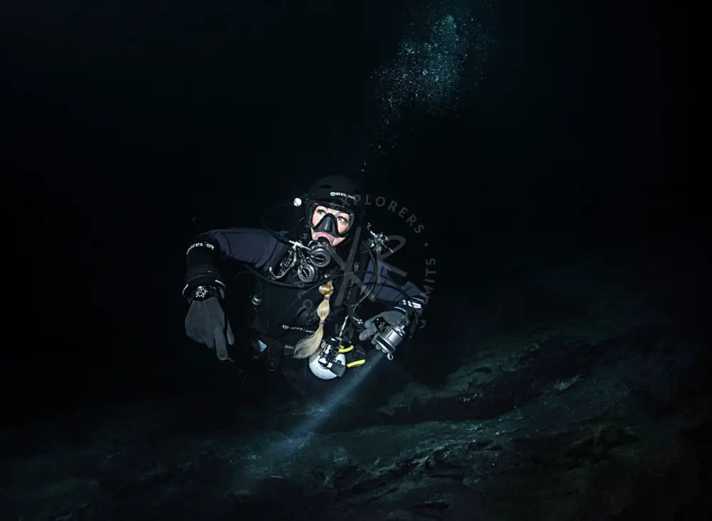 Scuba divers practicing communication and navigation in low visibility water in Saudi Arabia