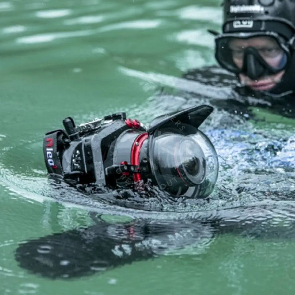 MOBY camera mount black and red underwater housing with clear dome port for waterproof photography