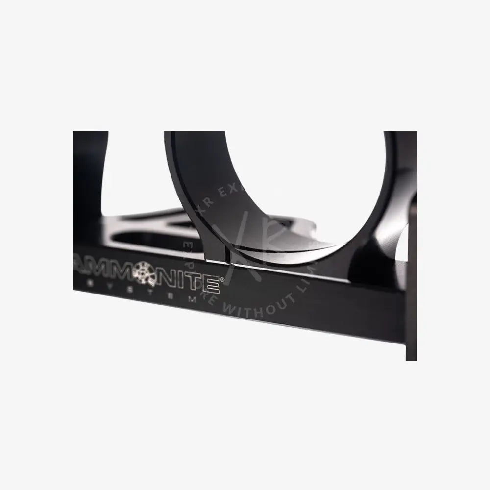 Black matte-finished ammonite system firearm mounting bracket with sleek angular design for modular goodman handle