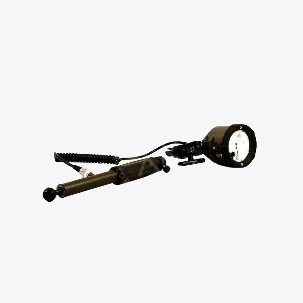 Black handheld spotlight with adjustable head and coiled cable attached to quick release carbon arm with grip