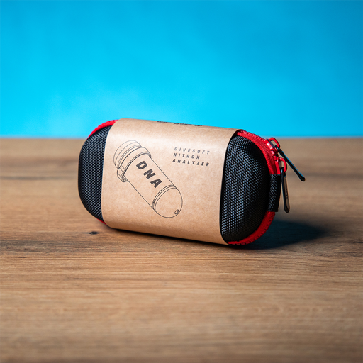 A pocket-sized Divesoft DNA Nitrox Analyzer in red and black color with the brand logo visible on the side.