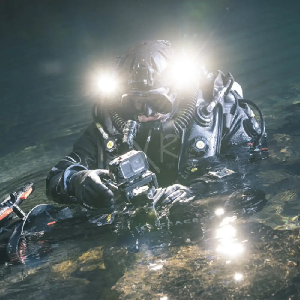 Black scuba diving suit with integrated headgear and bright underwater lights featuring roto camera mount