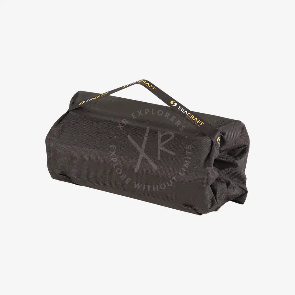 Black seacraft waterproof dry bag with yellow branding and reinforced stitching for air-travel battery storage