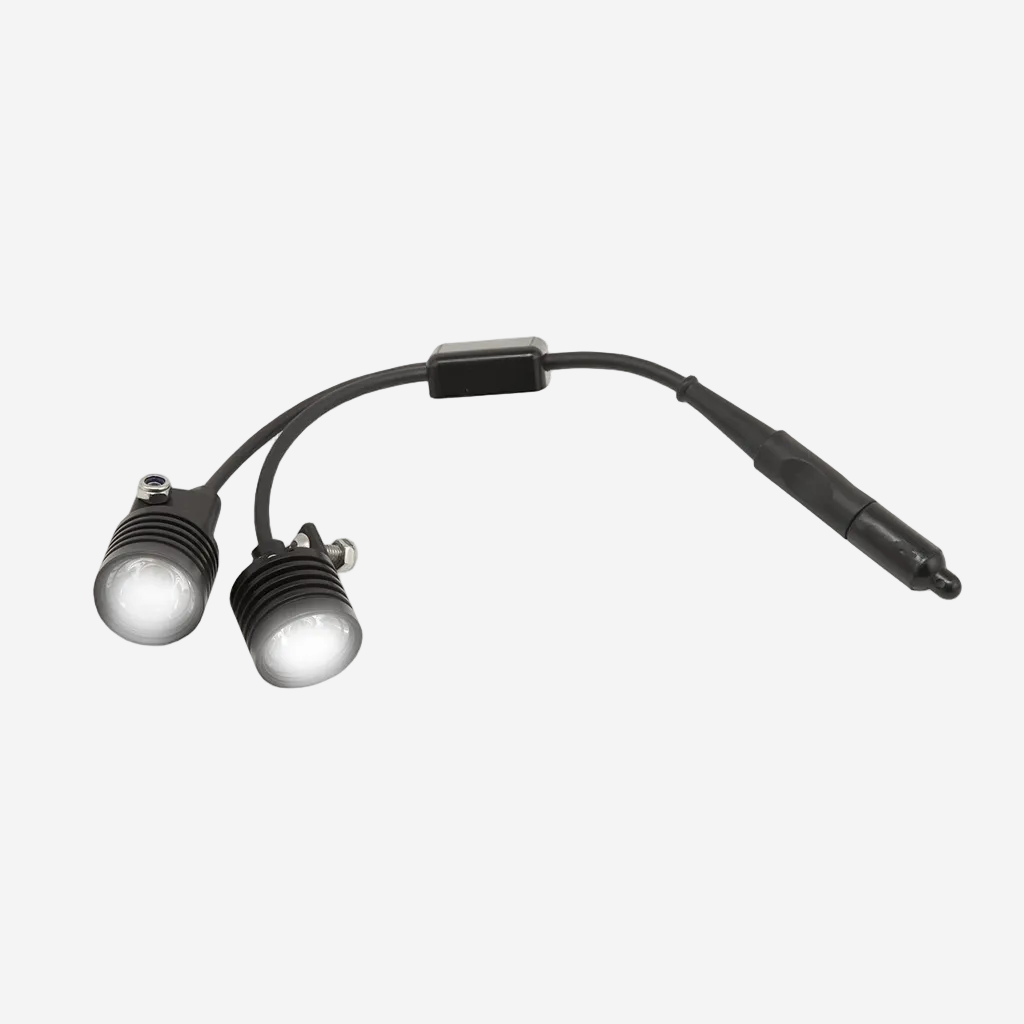 Two underwater lights connected by a y-cable with an on/off switch, primarily black in color.