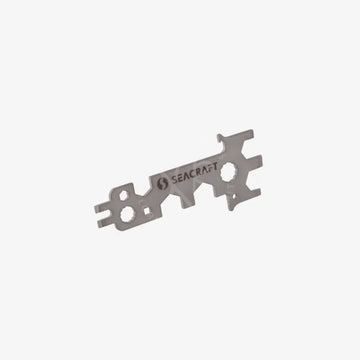 Stainless steel Seacraft universal key tool with a silhouette design, featuring a bottle opener function.