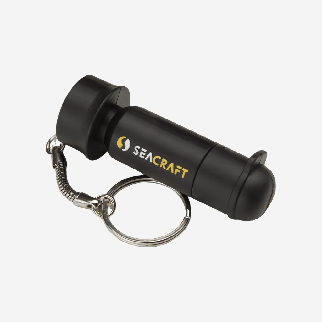 A Seacraft USB key chain designed to look like a scooter, black in color, with a metal keyring attachment.