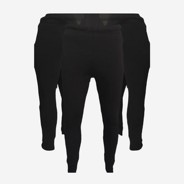 A pair of black Polartec pants designed for thermal regulation and compatibility with drysuit diving equipment.