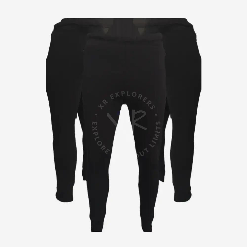 A pair of black Polartec pants designed for thermal regulation and compatibility with drysuit diving equipment.