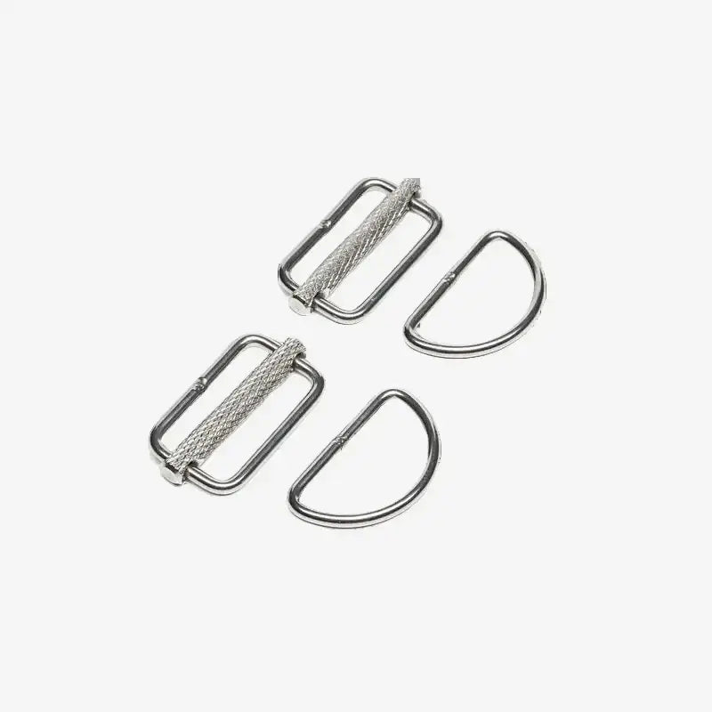 Two pairs of stainless steel sliding D-rings for sidemount diving, isolated on a white background.