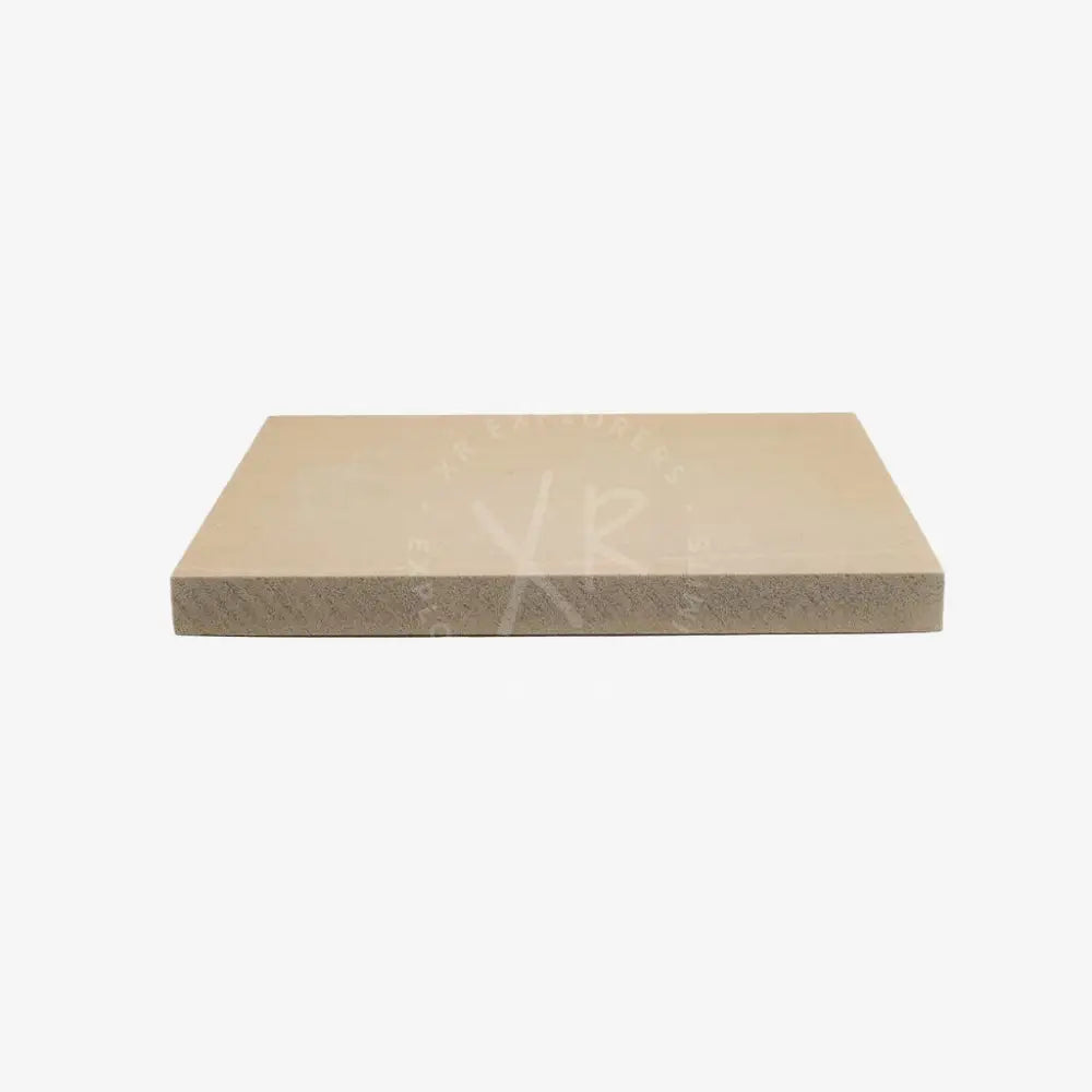 Beige rectangular carbonarm float stone slab with smooth top surface and textured rougher sides
