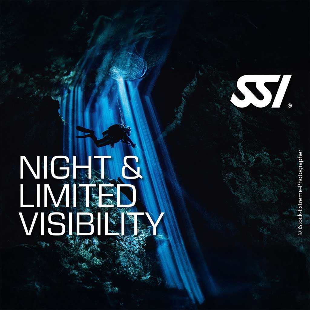 Promotional image for SSI Night & Limited Visibility diving course featuring a diver underwater with a flashlight, emphasizing the course's focus on night diving and low visibility conditions.
