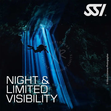Promotional image for SSI Night & Limited Visibility diving course featuring a diver underwater with a flashlight, emphasizing the course's focus on night diving and low visibility conditions.