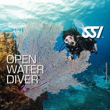 Promotional image for SSI Open Water Diver course featuring a diver underwater with marine life, including a large sea fan.