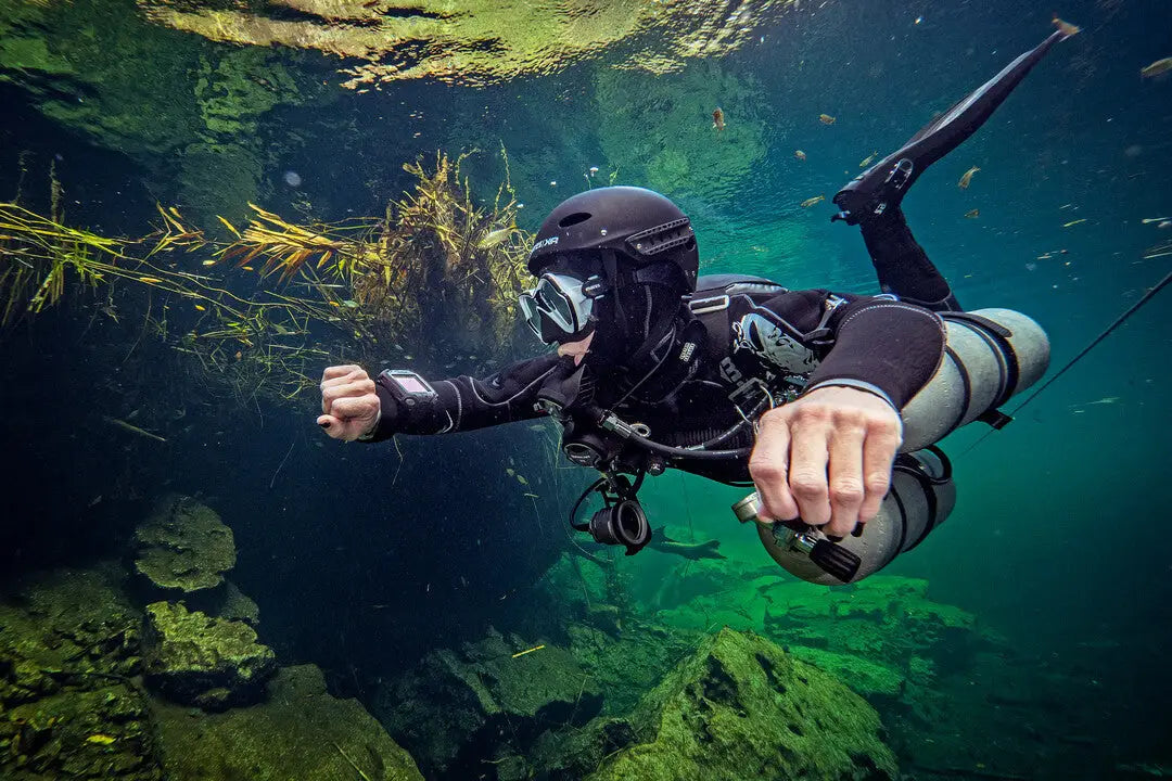 Open water sidemount diver maintaining perfect horizontal trim during training in Oman