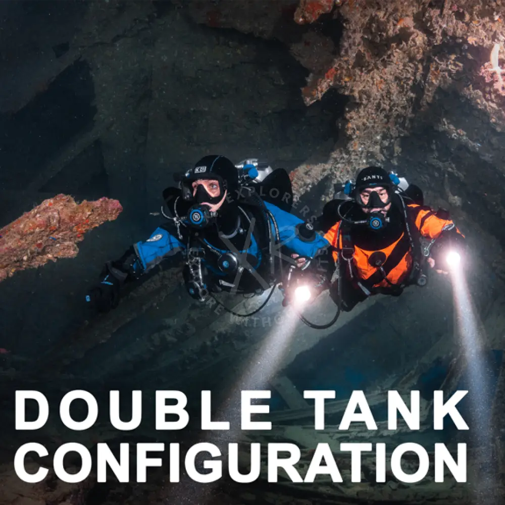Two scuba divers in blue and orange twin mastery suits with double tanks showcasing full diving gear