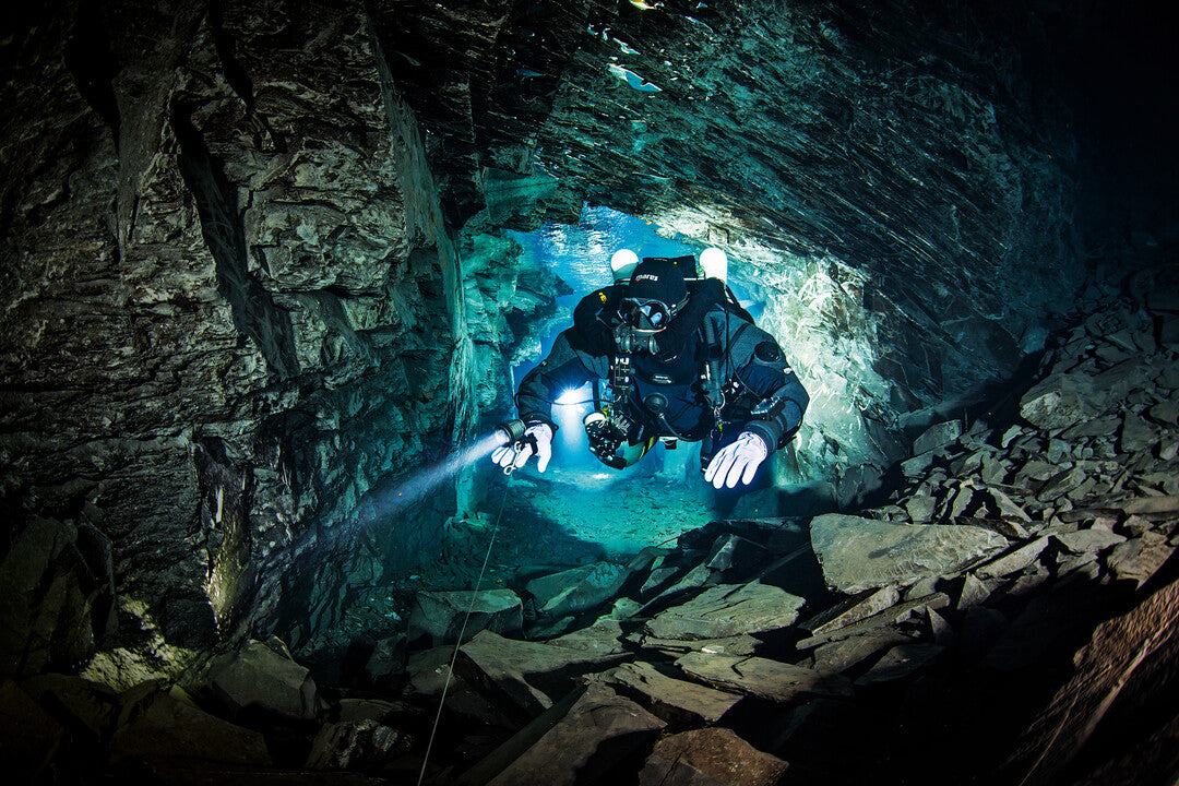 A promotional image featuring a diver underwater with text overlay for 'Extended Range Nitrox Diving' course.