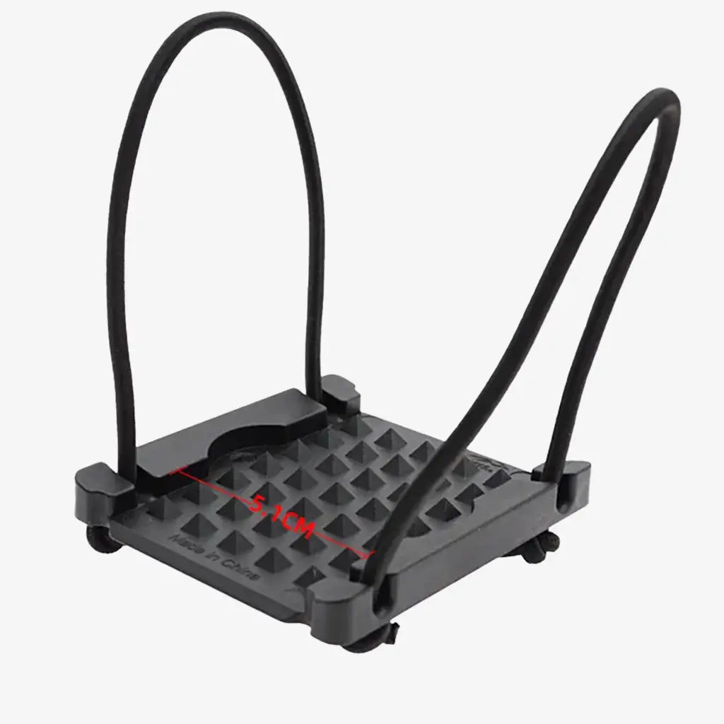 Black plastic weight fixing plate with textured grip bicycle pedal holder and curved handlebars shown from the back side