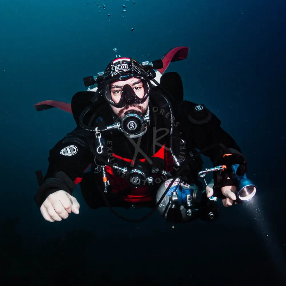 Diver wearing drysuit for thermal protection during winter diving season in Dubai